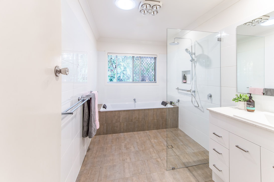 Wetroom bathroom with inset bathtub in Suffolk Park NSW 2481 by Northern Rivers Bathroom Renovations.