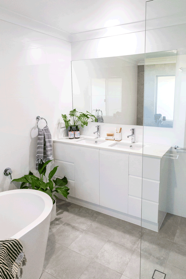 Grey & white Bathroom renovation in Ballina NSW with White vainty .