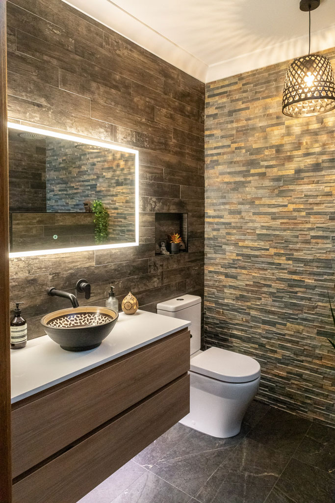 Ensuite bathroom in Alstonville NSW featuring Led mirror, timber vanity, stone benchtop and natural look tiles.