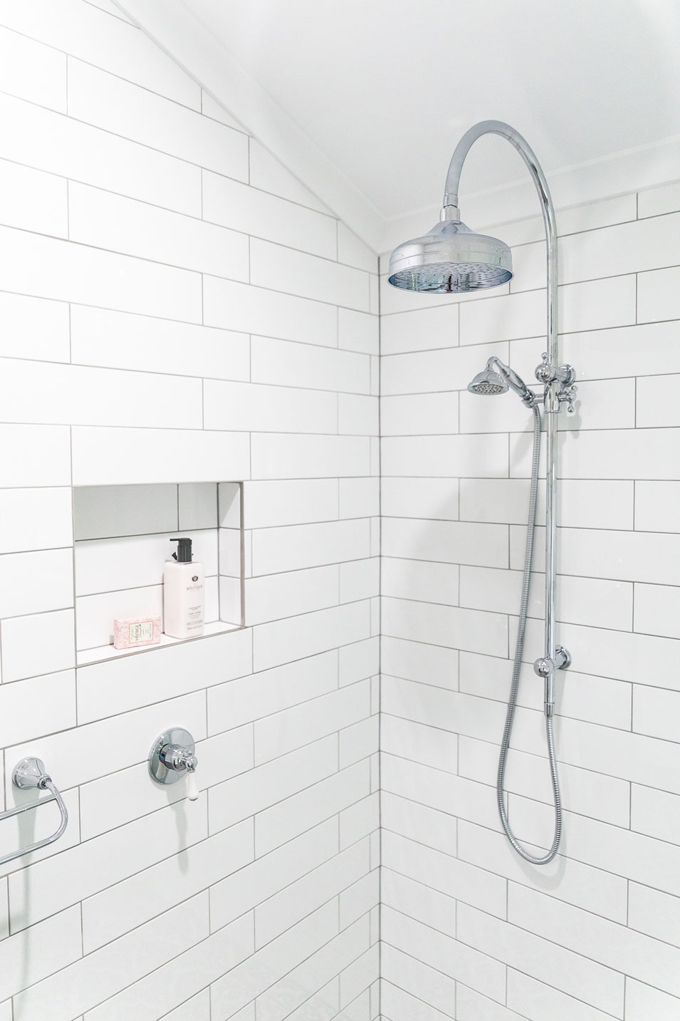 Fienza Lillian shower set in Chrome is a stand out feature in the traditional shower space. Complete with white subway wall tiles with light grey grout.
