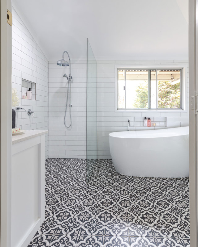 Cottage Bathroom Renovation in Lismore NSW by Northern RIvers Bathroom Renovations. Traditional bathroom style with white subway wall tiles with light grey grout, white and black encaustic floor tile, free standing bath, walk in shower.