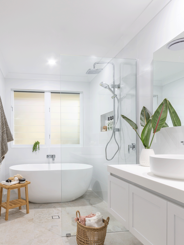 Modern Coastal Bathroom Renovation completed by Northern Rivers Bathroom Renovations in Lennox Head NSW. Original bathroom was converted into a wetroom with open shower and freestanding bathtub.
