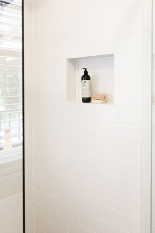 White subway tiles laid brick bond in a shower by Northern Rivers Bathroom Renovations